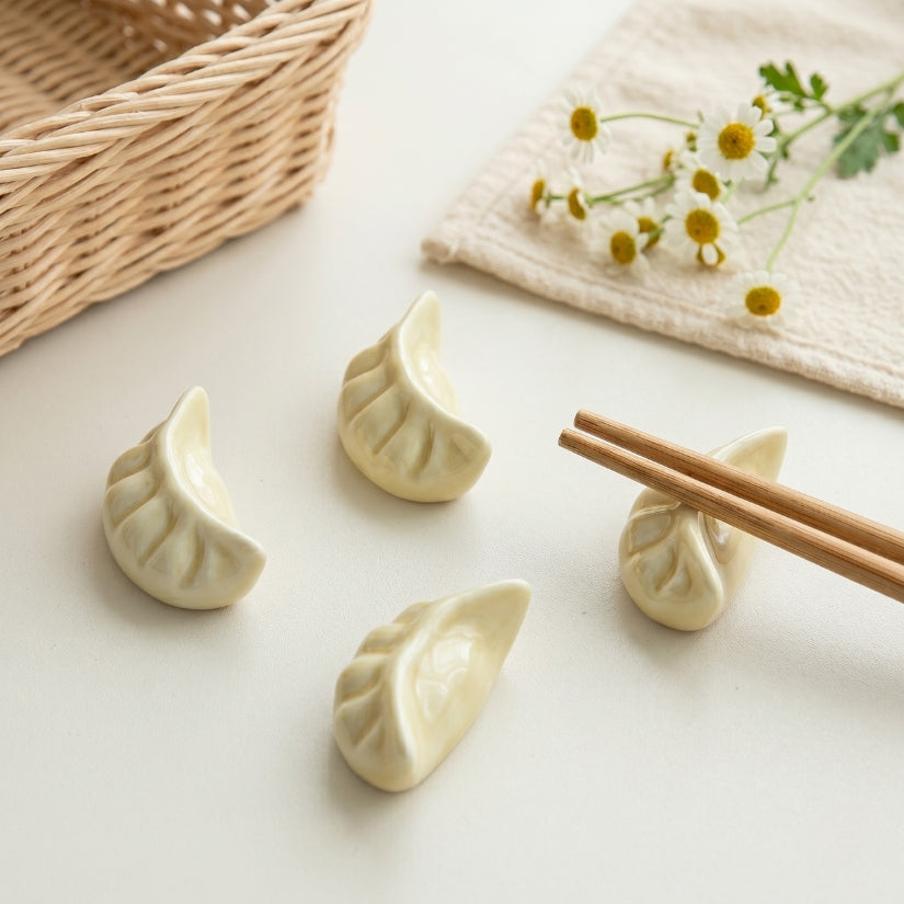 Dumplings on a white surface with chopsticks and a woven basket in the background. chopstick rest, dumpling chopstick holder, ceramic tableware, Asian dining accessories, dim sum gift, Japanese table decor, chopstick stand set
