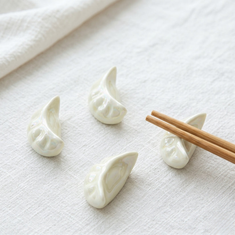 White ceramic dumpling holders on a white surface with wooden chopsticks. chopstick rest, dumpling chopstick holder, ceramic tableware, Asian dining accessories, dim sum gift, Japanese table decor, chopstick stand set
