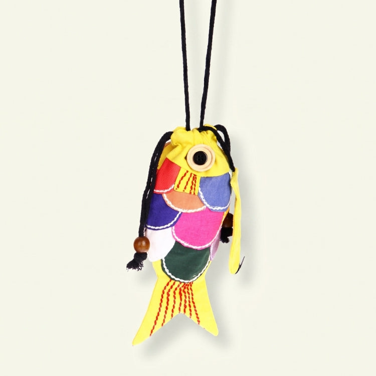 Colorful fish-shaped keychain on a white background