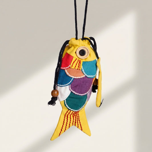 Colorful fish-shaped drawstring bag on a light gray background